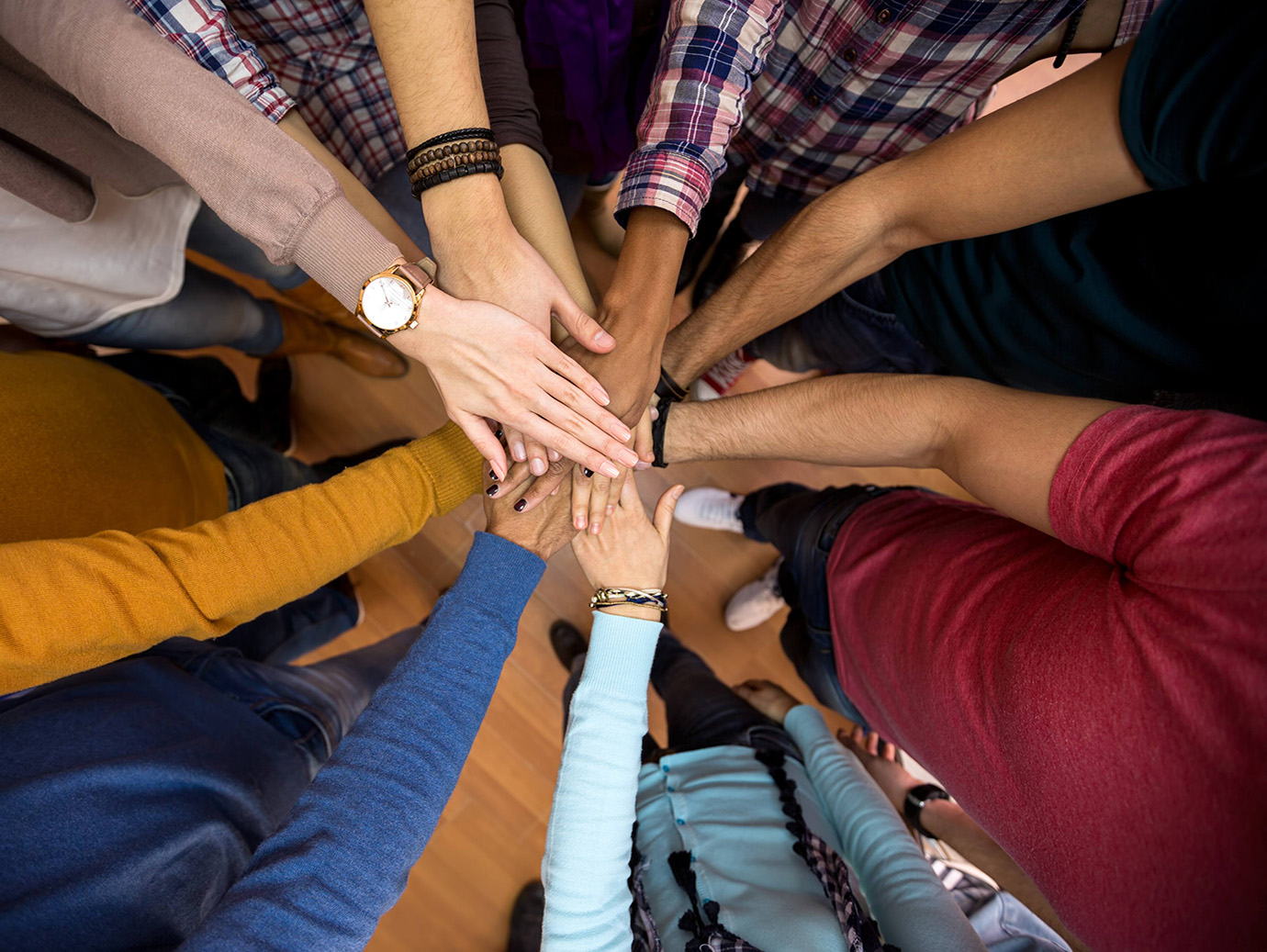 Close-up of all hands together