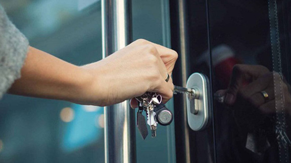 Close up of a person hand locking the door
